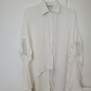 White flowy, high low shirt.